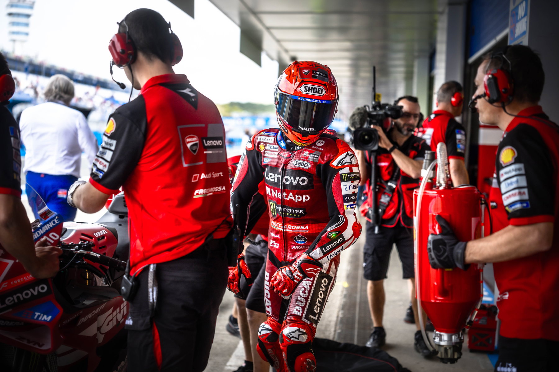 Marc Marquez leaving the Ducati box with helmet and mechanics – MotoGP Spain GP Jerez 2026