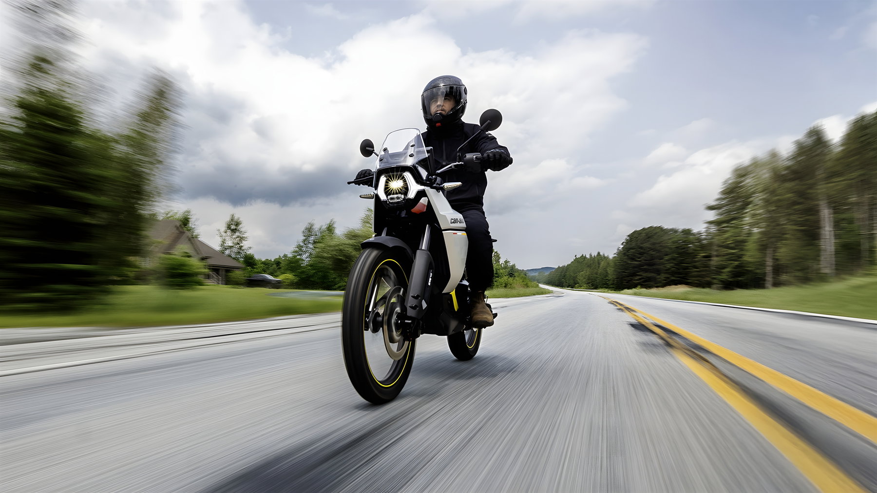 Can-Am Origin 2025 front view on winding country road with LED headlight on and motion blur