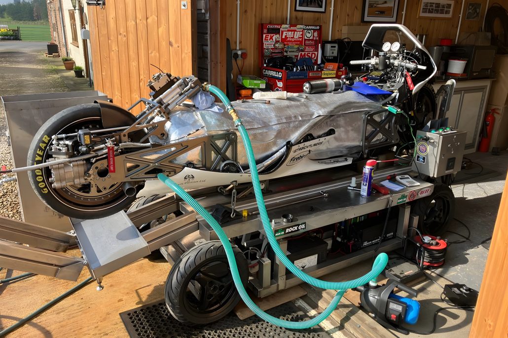 Force of Nature rocket motorcycle – workshop view without fairing showing the steam pressure vessel, piping and de Laval nozzle