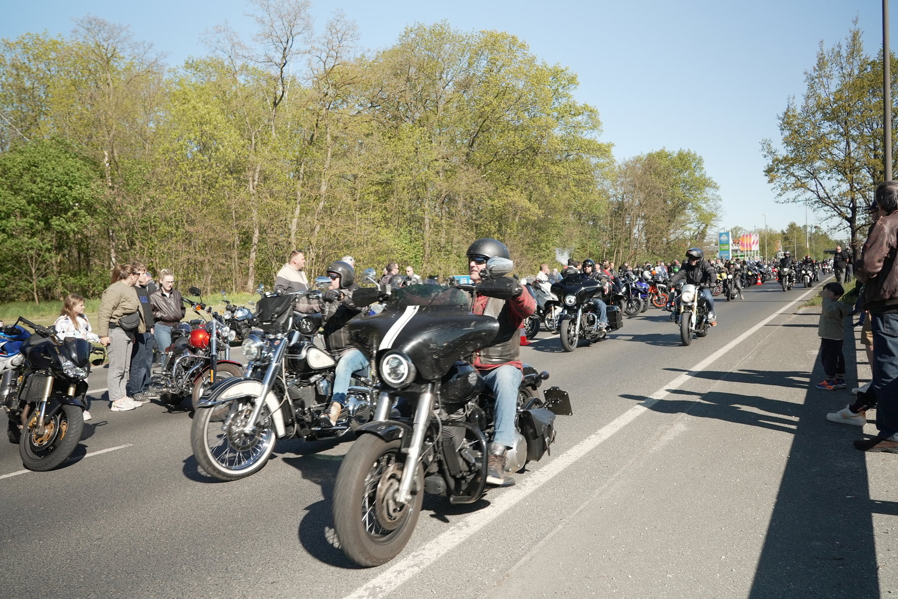 Long line of waiting motorcycles on country road