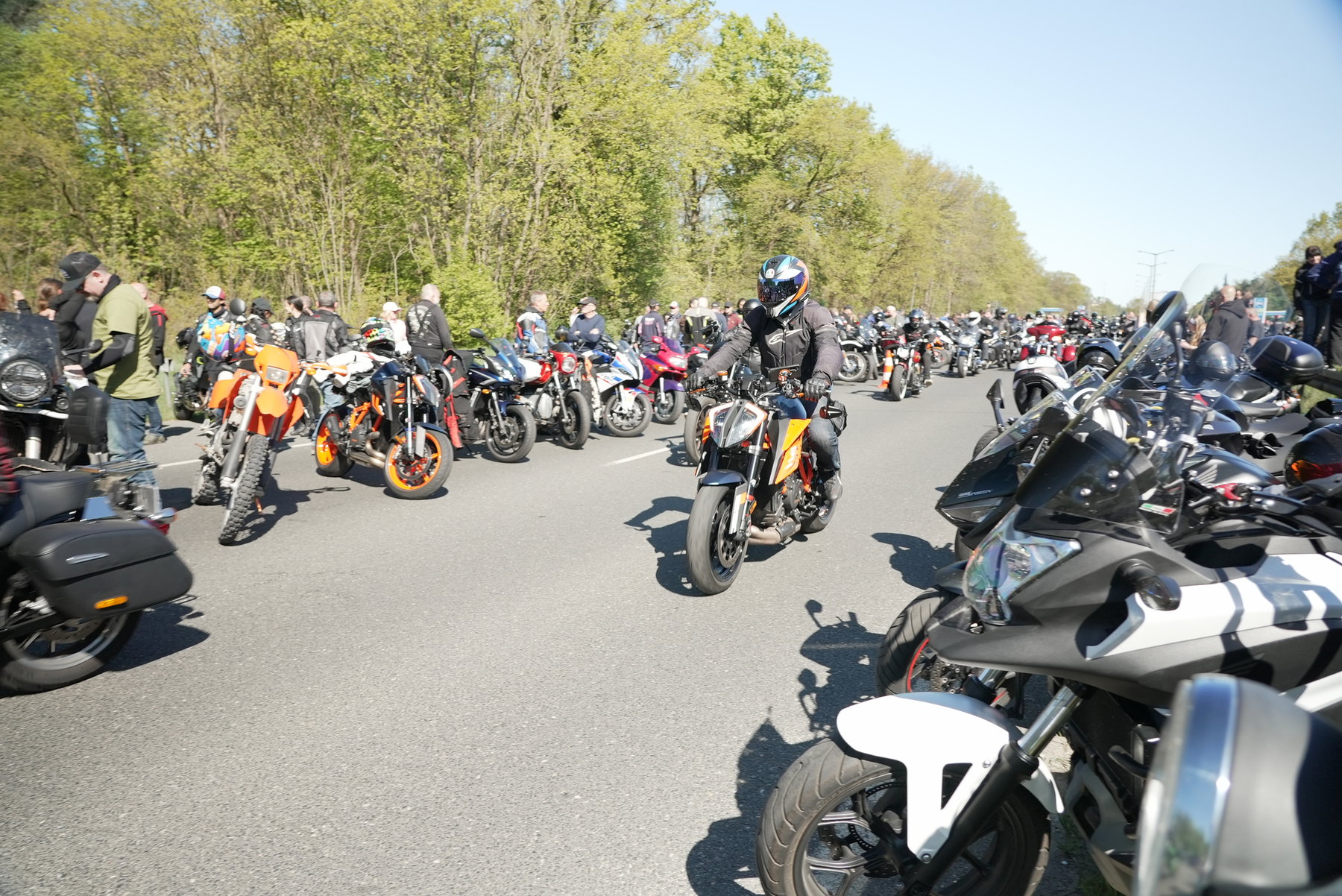 Colorful mix of motorcycles in convoy