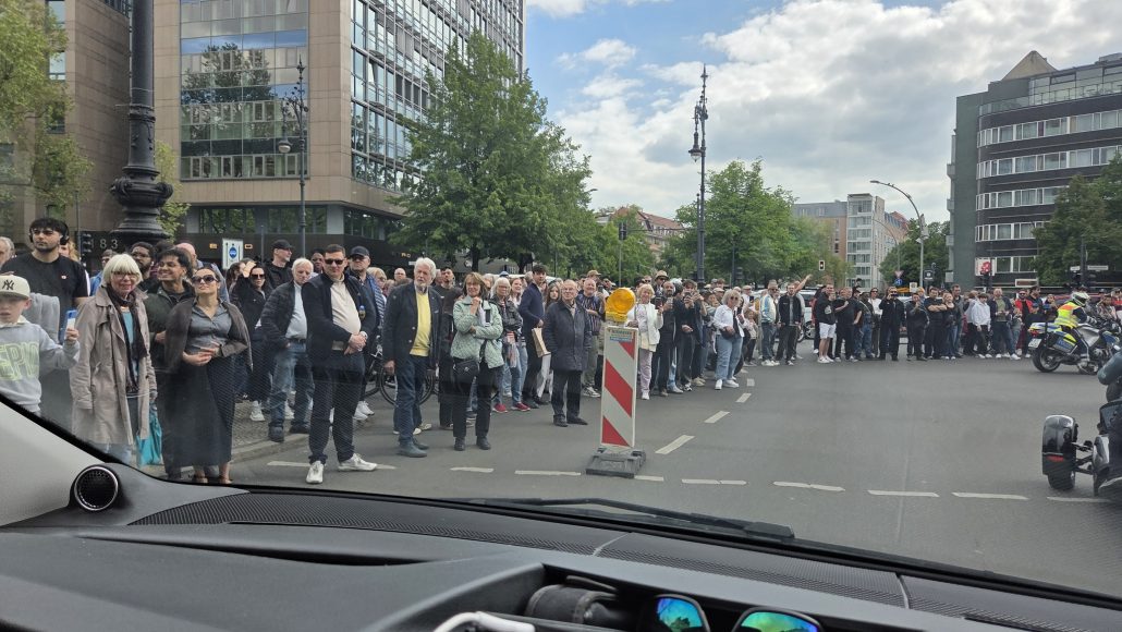 Steel & Speed 2026 – Enthusiastic spectators on Kurfürstendamm watching the motorcycle convoy, photographed from a vehicle within the demonstration