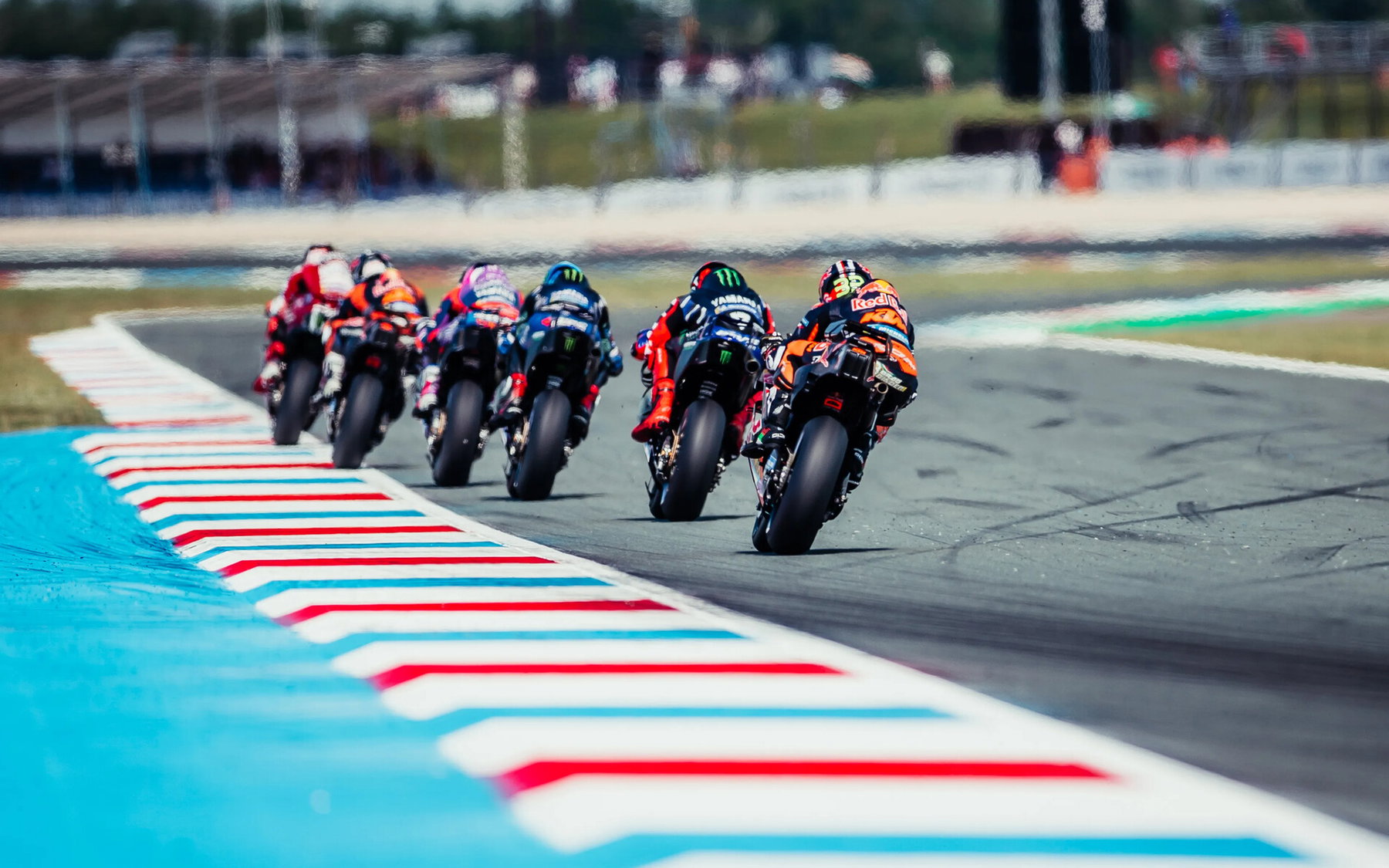 Brad Binder leaning on the Red Bull KTM RC16 with number 33 – free practice at the MotoGP Dutch GP Assen 2026