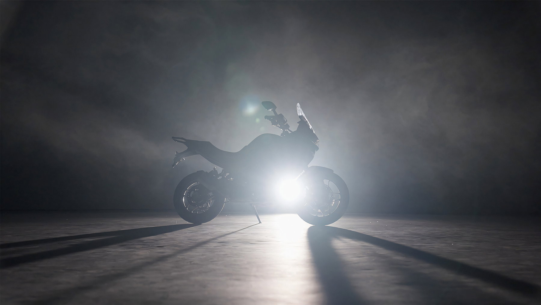 Norton Manx R With Suspension Travel Sensors: What Changes For Riders 4 Norton Atlas GT 2026 – middleweight adventure tourer as an illuminated silhouette in backlight, side view