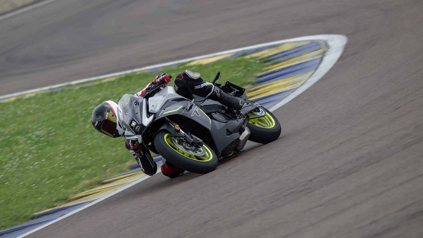 Benelli Tornado 550: In Europe Since 2025, Now Launching in the US for $5,999 3 Benelli Tornado 550 2026 in Tech Silver during a test ride at the Autodromo di Modena, rider with a white-and-red helmet leaning deep into a right-hand corner, track with blue-and-yellow curbing
