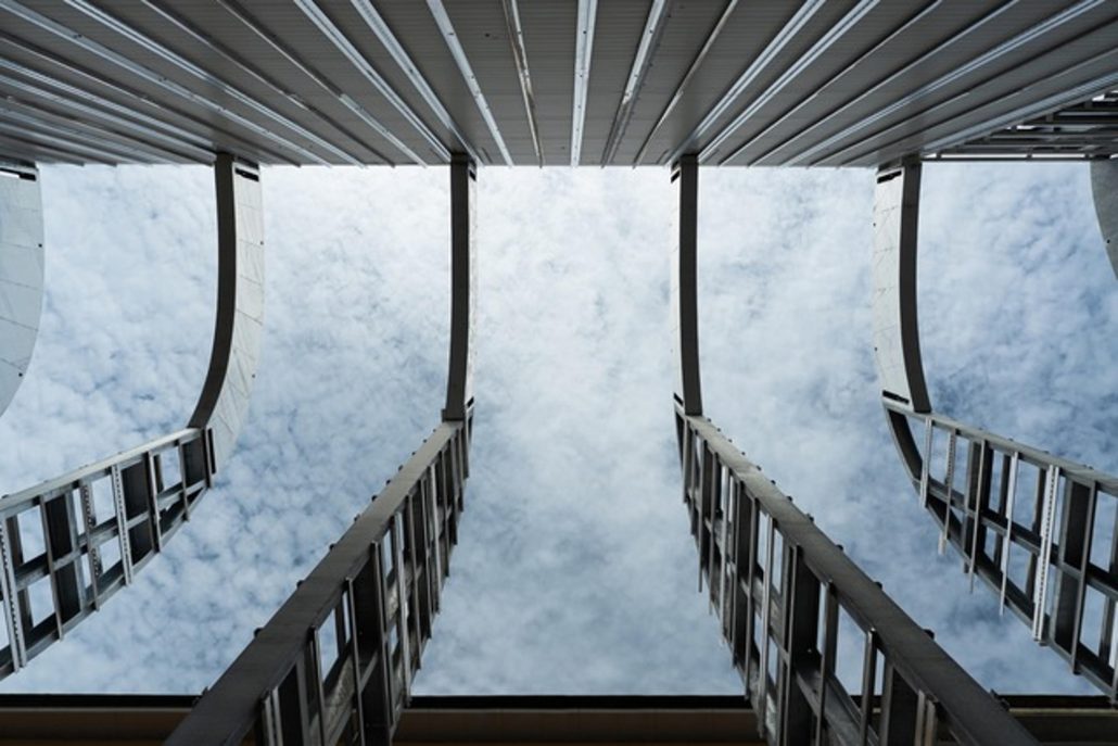 Moto Guzzi Opens New Factory: What's Changing in Mandello in 2026 5 Moto Guzzi World Days 2026 – architectural detail inside the new hall, view through the curved roof structure toward the sky